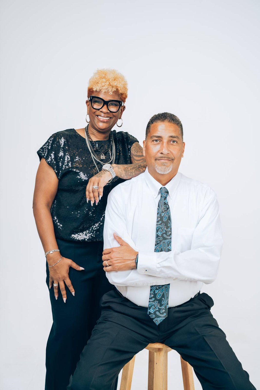 Monica and Marcus Lee seated together in the studio